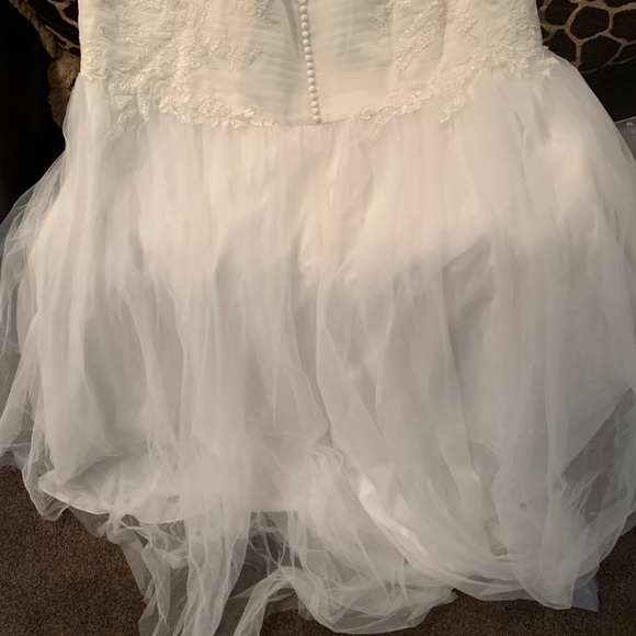 Front stops at the knee and the back drapes down - Picture 2 of 5